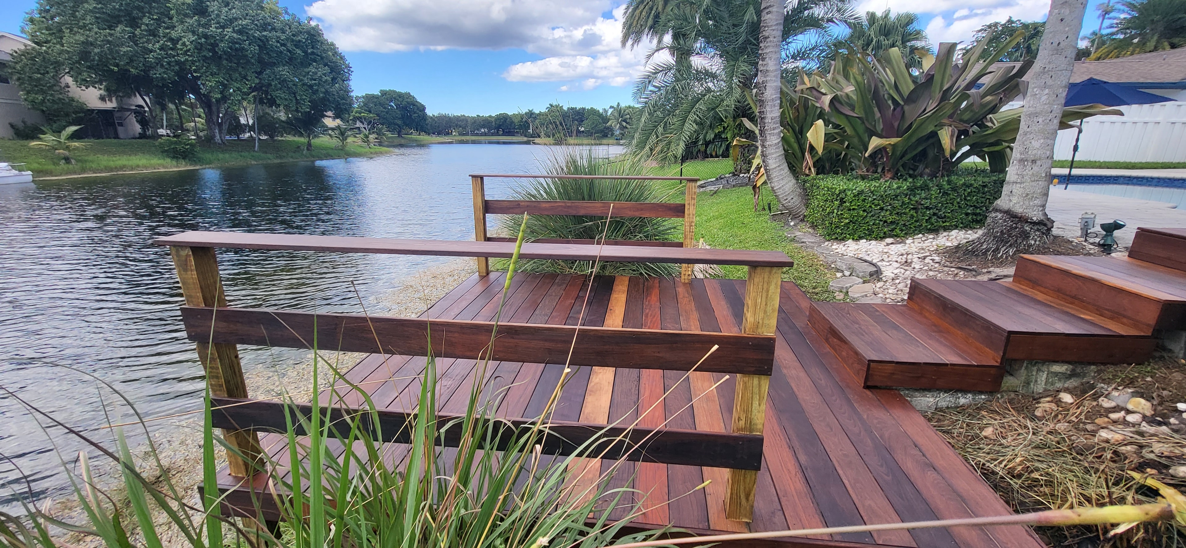 Hardwood dock overlooking a tropical waterway — South Florida